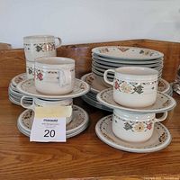 Stacked set showing mugs, bowls, side plates, saucers and dinner plates