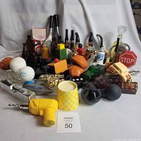 Group shot of entire lot showing variety of Avon novelty bottles