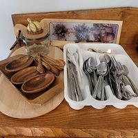 Group shot of cutlery tray, teak dishes, garlic keeper, cutting boards