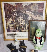 Overall lot showing framed prints, cookie jar, candlestick, dancer plaques, dog figurine