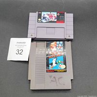 Front view of both cartridges showing titles and wear