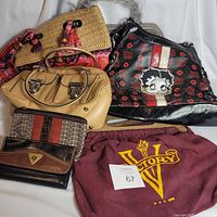 Group shot of all handbags and wallets in lot