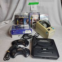 Full lot including console, controllers, label printer, media stack, converter box