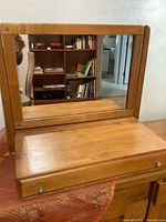Front view of mirror, base and drawer