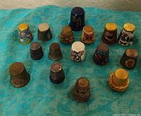 Group shot of all 16 thimbles