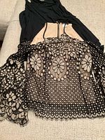 Both tops laid flat showing lace detail and halter top