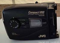 Right side view of JVC Compact VHS camcorder showing branding, Intelligent Function Control label and 14x zoom marking