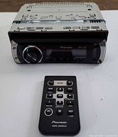 Front view of Pioneer DEH-2100IB head unit with remote controller