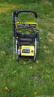 Front view showing Ryobi 2000 PSI 1.2 GPM electric pressure washer with hose and wand