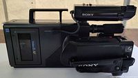 Left side view of Sony Video8 AF camcorder showing cassette compartment, control switches, handle, and viewfinder