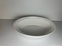 Top view of white oval casserole dish