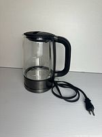 Glass kettle seated on black/stainless power base with cord
