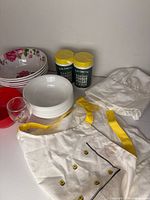 All items grouped: floral bowls, Corelle bowls, red bowl, glass, pectin canisters, chef hat and apron