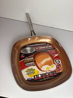 Top view of Gotham Steel 12" square fry pan with factory label