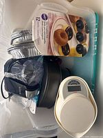 Overall view showing all items inside teal bin