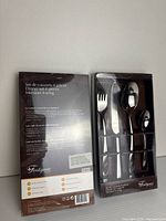 Front of both boxed Fontignac 4-piece flatware sets