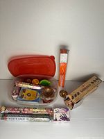 Overall lot showing bin, incense packs, bell and matches