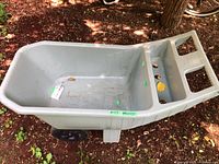 Full view of gray plastic Ames garden cart, interior visible