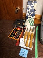 Overall lot showing woodburner, tip case, chisel tray, outer chisel box