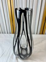 Full view of clear glass vase with black ribbon design