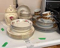 Group view of mixed china stacks, cups, ginger jar