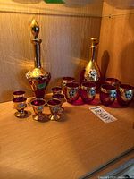 Group view showing both decanters, tumblers and stemmed cordial glasses