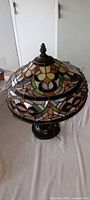 Full view of stained glass dome shade and finial