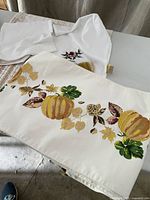 Pumpkin motif runner and folded bird motif runner