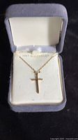 Inside jewelry box with 14k gold filled cross pendant and chain