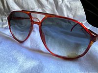 Perspective view of tortoiseshell Carrera sunglasses showing gradient lenses and frame condition