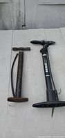 Both bicycle pumps side by side on surface