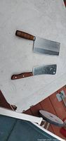 Both cleavers showing blade shapes and handles