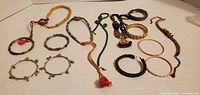 Assorted bracelets and anklets laid out