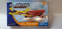 Front of sealed Flaunting Aircraft toy box showing plane and launcher