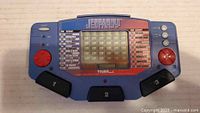 Front of Tiger Jeopardy handheld game showing screen and controls