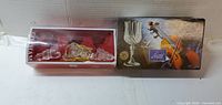 Boxed cordial glass set and boxed clear glass sleigh ornament