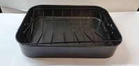 Full view of rectangular broiler pan with rack inside