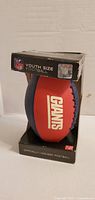Front of boxed New York Giants football showing logo and packaging