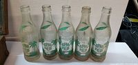 Front view of five Royal Palm bottles showing graphics
