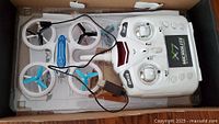 Drone, controller, charger, papers inside box