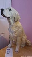 Full front-side view of ceramic golden retriever figurine