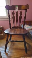 Front view of wooden Windsor dining chair