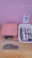 Lot overview with jewelry box, watches in tray, bag of earrings