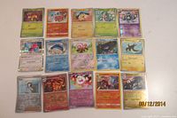 Full group shot of all 15 cards laid out in three rows