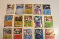 All fifteen Pokémon cards laid out in four rows