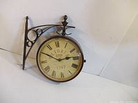 Clock front on bracket