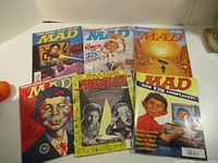All six MAD magazines laid out showing covers