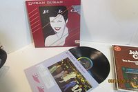 Front view of album outer sleeve, inner sleeve and vinyl record