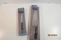 Two boxed Jamie Oliver knives, utility and chef sizes