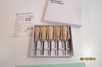 boxed set showing chisels, guide, leaflet and box lid